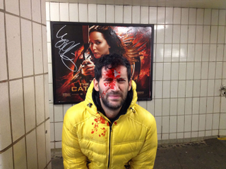 Illustration for article titled Man pretends to be shot by violent movie posters